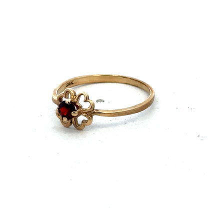 9ct yellow gold ring size M by Reeves and Sons, close-up view showcasing its polished band and elegant design.