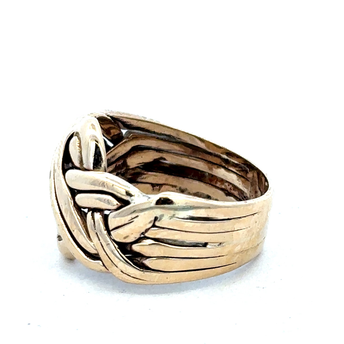 9ct yellow gold puzzle ring in size U with intricate interlocking design, crafted by Reeves and Sons.