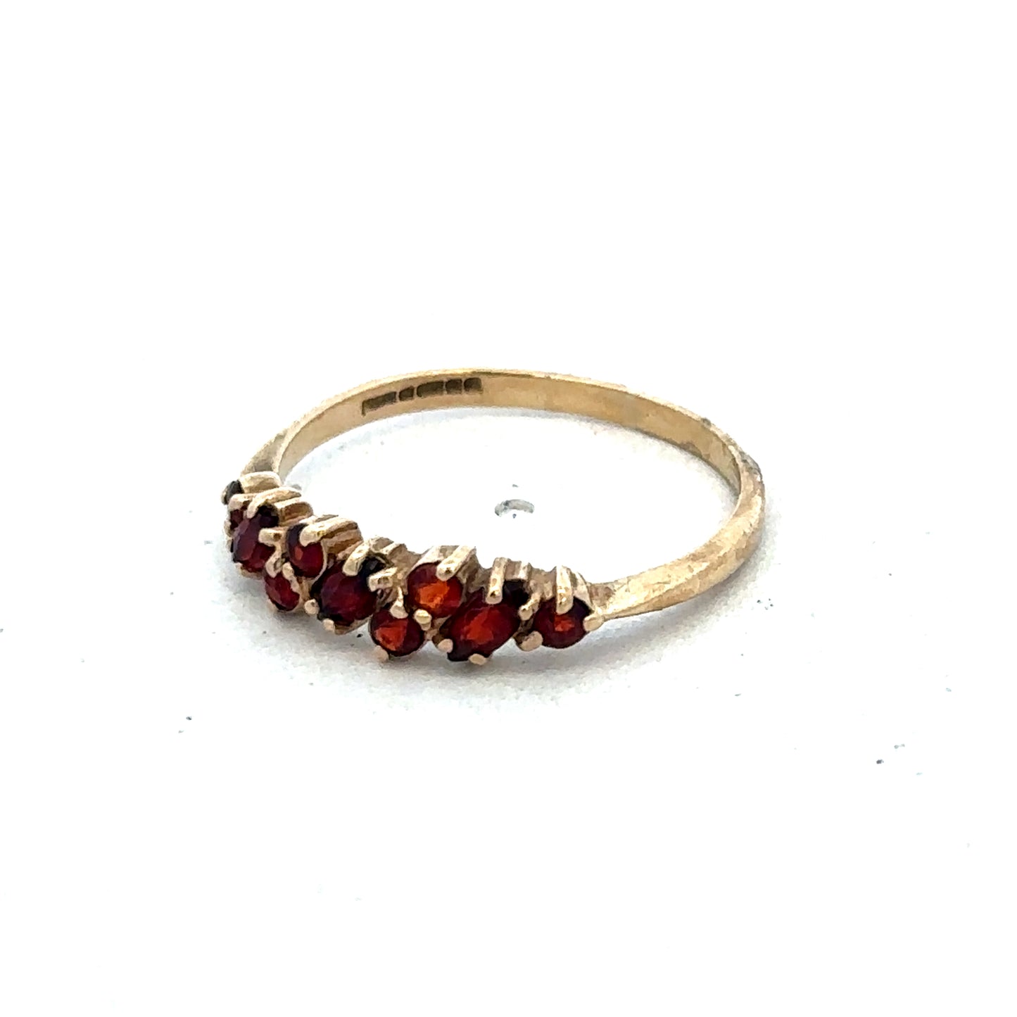 9ct yellow gold ring in size N by Reeves and Sons, showcasing a smooth polished band on a white background.
