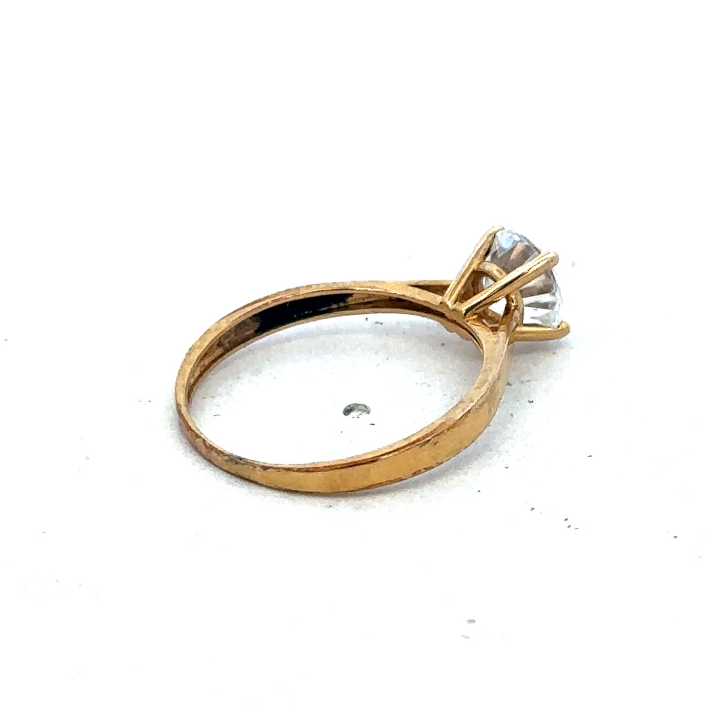 9ct yellow gold ring size L by Reeves and Sons, featuring a polished band with a simple, elegant design.