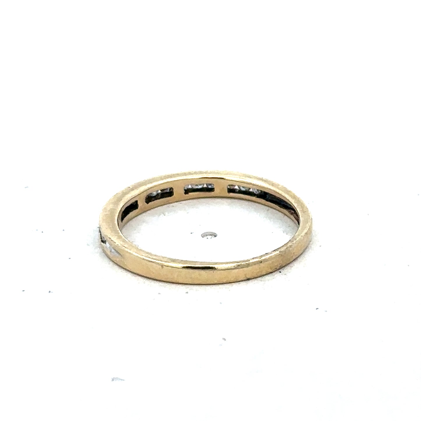 9ct yellow gold diamond half eternity ring in size N with sparkling stones, crafted by Reeves and Sons.