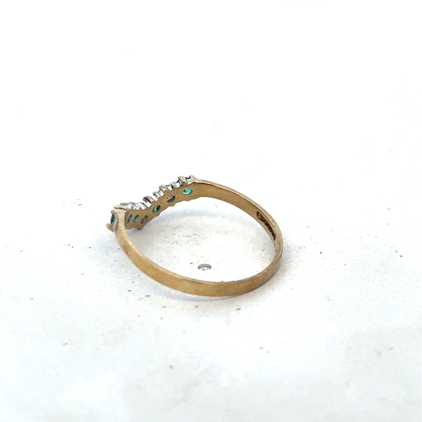 9ct yellow gold emerald and diamond ring with intricate design, size O1/2, by Reeves and Sons, showcasing elegant craftsmanship.