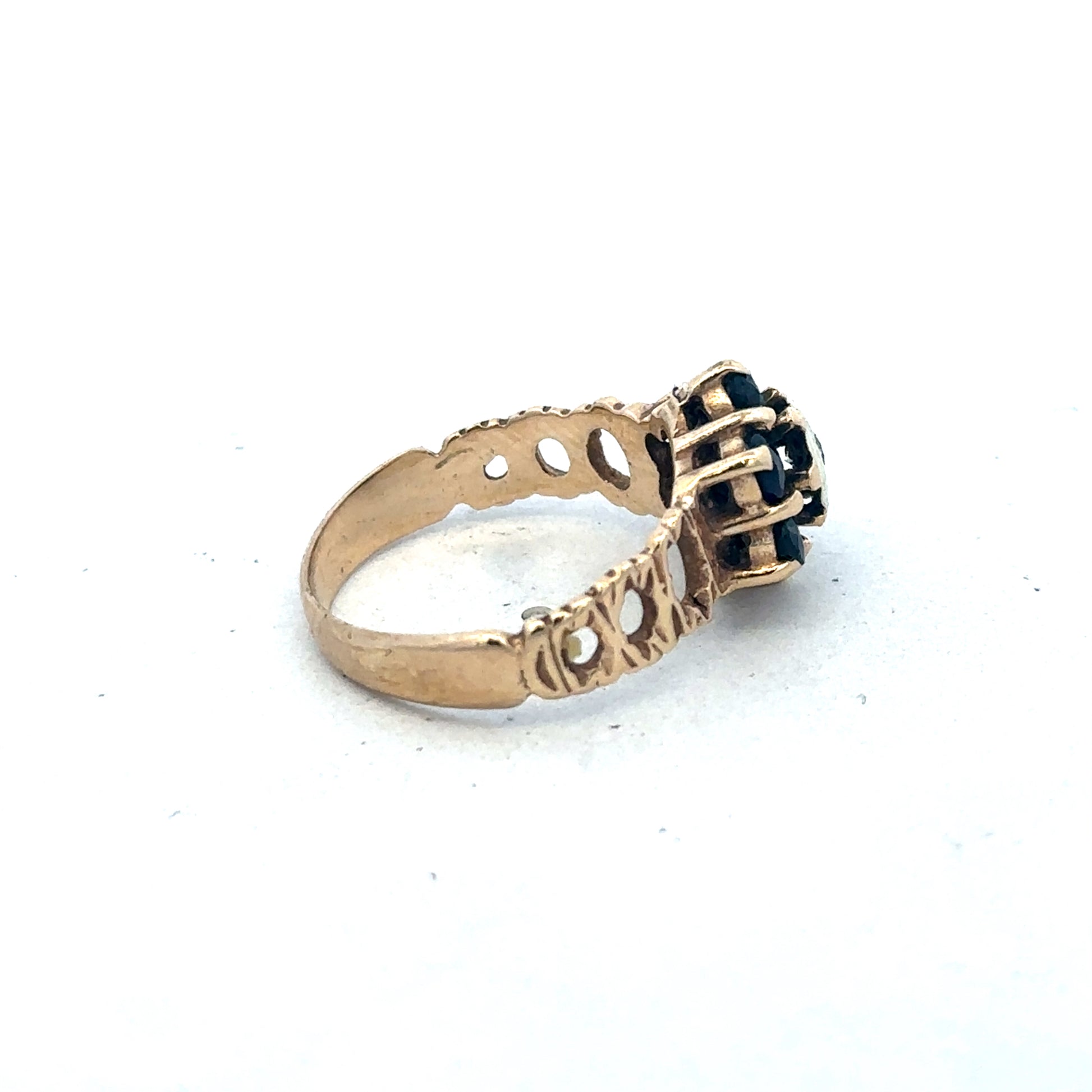 9ct yellow gold sapphire and diamond ring in size M, featuring a central sapphire gemstone with diamond accents, by Reeves and Sons.