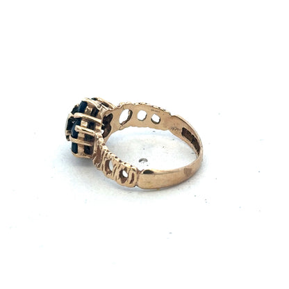 9ct yellow gold sapphire and diamond ring, size M, featuring a central sapphire and sparkling diamonds, by Reeves and Sons.