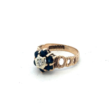 9ct yellow gold sapphire and diamond ring in size M, featuring a central sapphire with diamond accents, by Reeves and Sons.