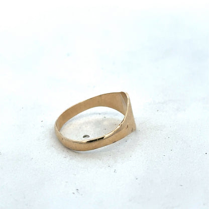 9ct yellow gold signet ring in size M by Reeves and Sons, close-up showing polished surface and classic design.