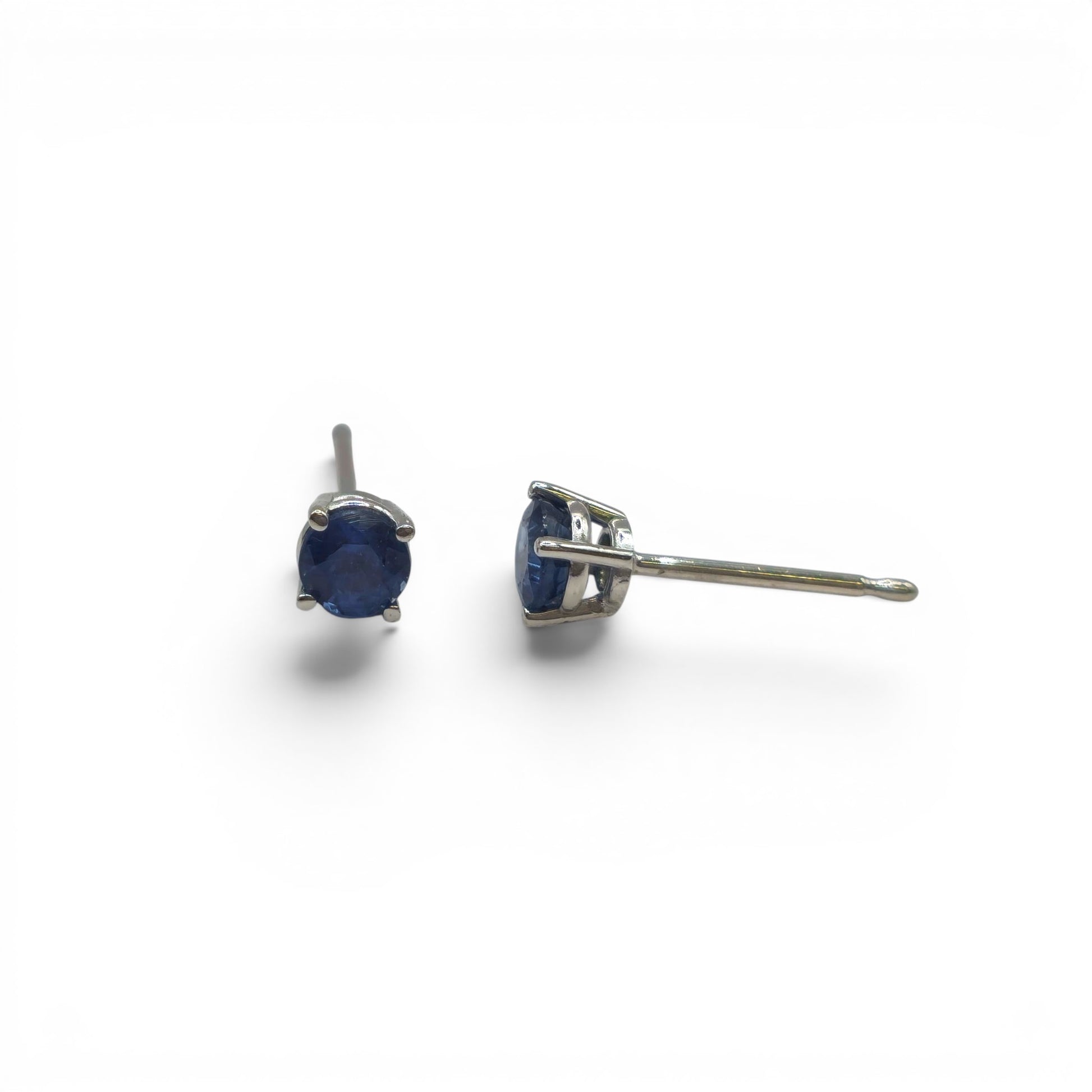 14ct white gold sapphire stud earrings with round blue sapphires, featuring a classic design by Reeves and Sons.