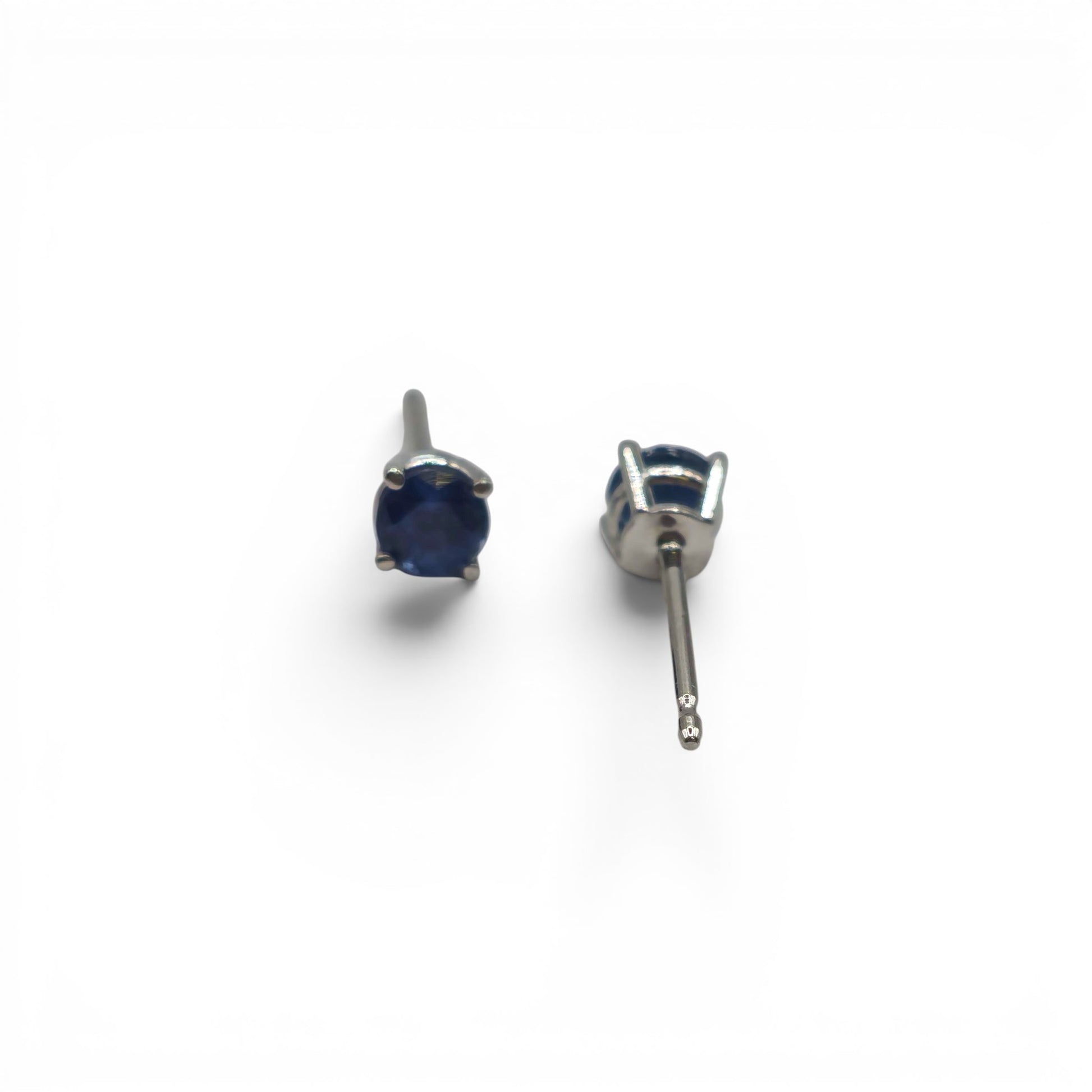 14ct white gold sapphire stud earrings by Reeves and Sons, featuring sparkling blue sapphires set in elegant white gold.