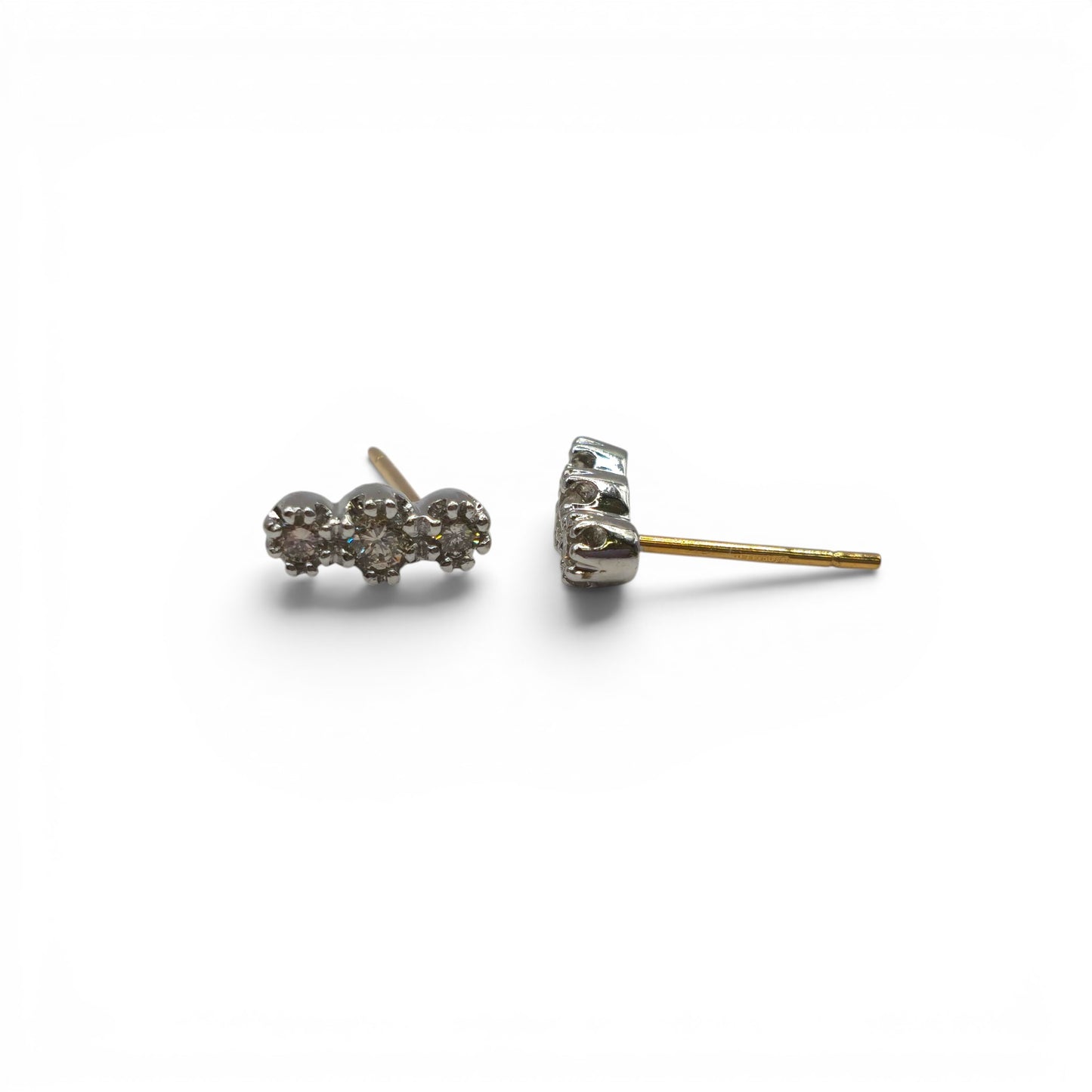 18ct yellow and white gold diamond stud earrings by Reeves and Sons, featuring sparkling diamonds in a classic setting.