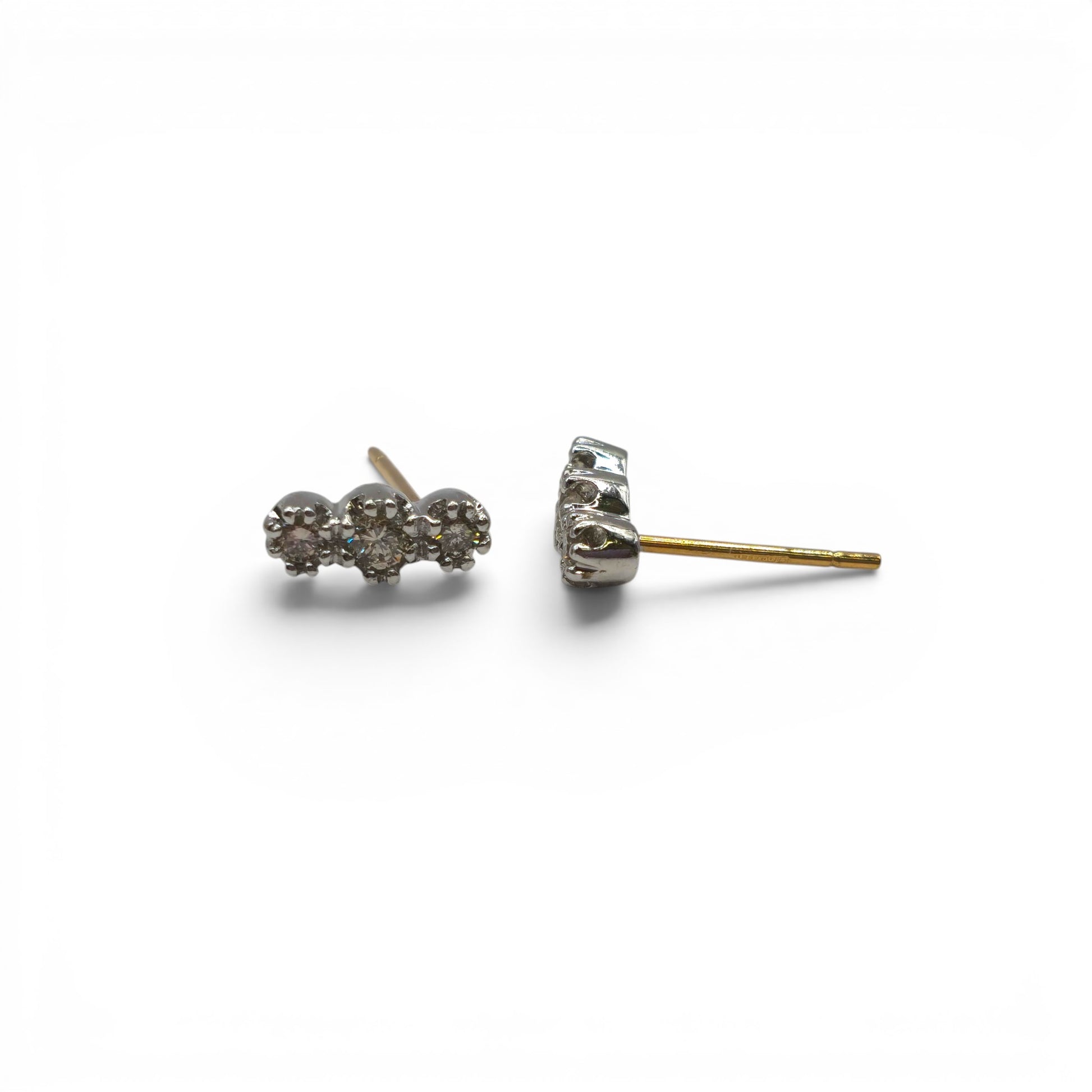 18ct yellow and white gold diamond stud earrings by Reeves and Sons, featuring sparkling diamonds in a classic setting.