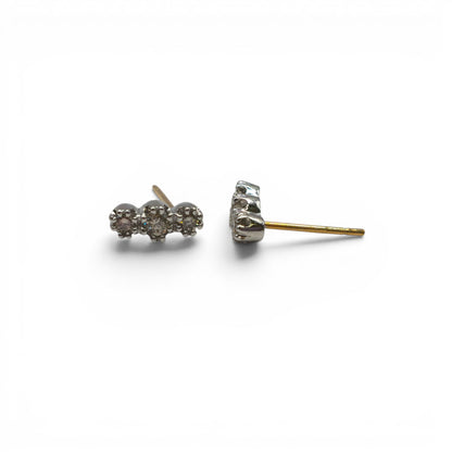 18ct yellow and white gold diamond stud earrings by Reeves and Sons, featuring sparkling diamonds in a classic setting.