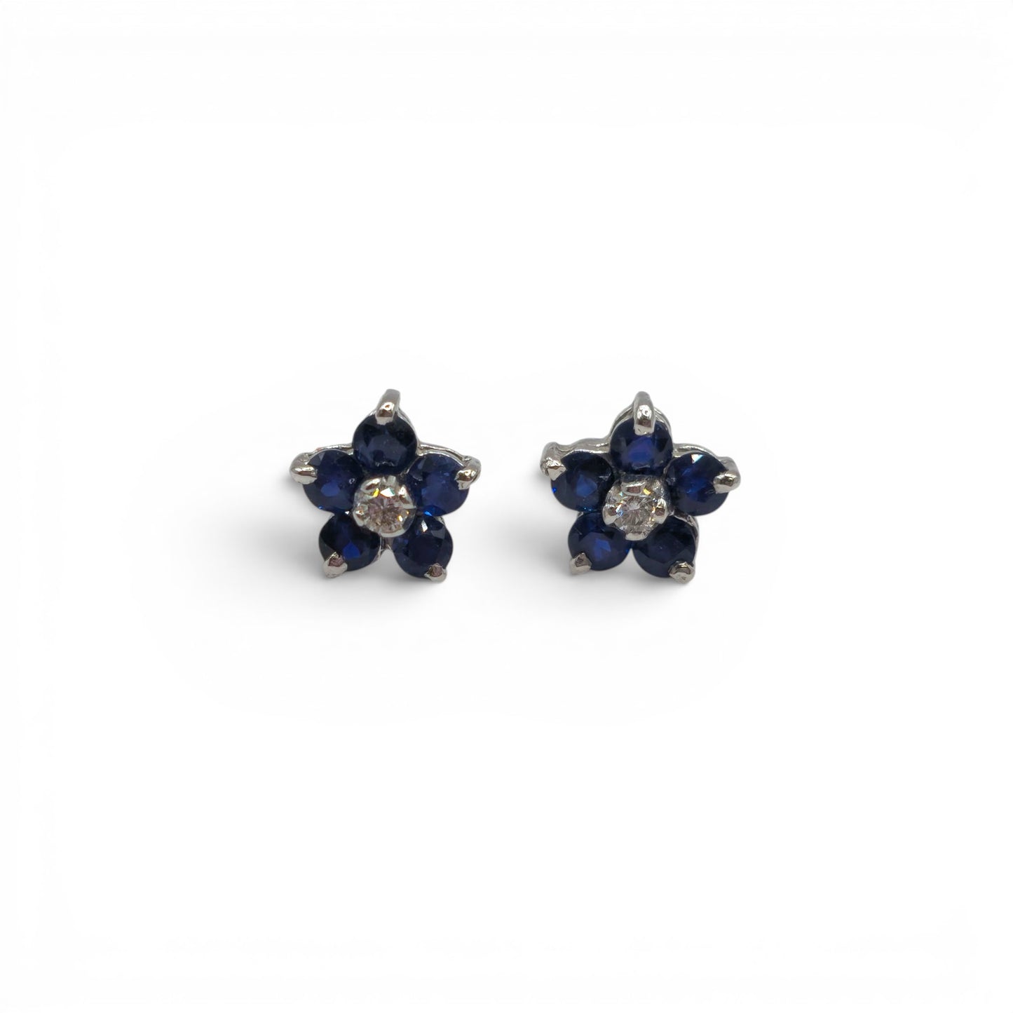 18ct white gold daisy sapphire and diamond stud earrings, elegant jewelry with floral design from Reeves and Sons.