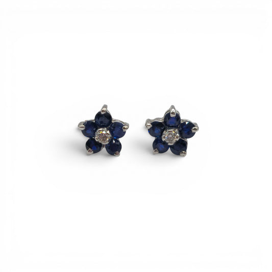 18ct white gold daisy sapphire and diamond stud earrings, elegant jewelry with floral design from Reeves and Sons.