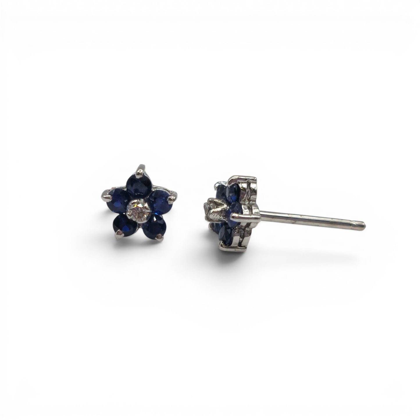 18ct white gold daisy sapphire and diamond stud earrings by Reeves and Sons, featuring floral design with sparkling gemstones.