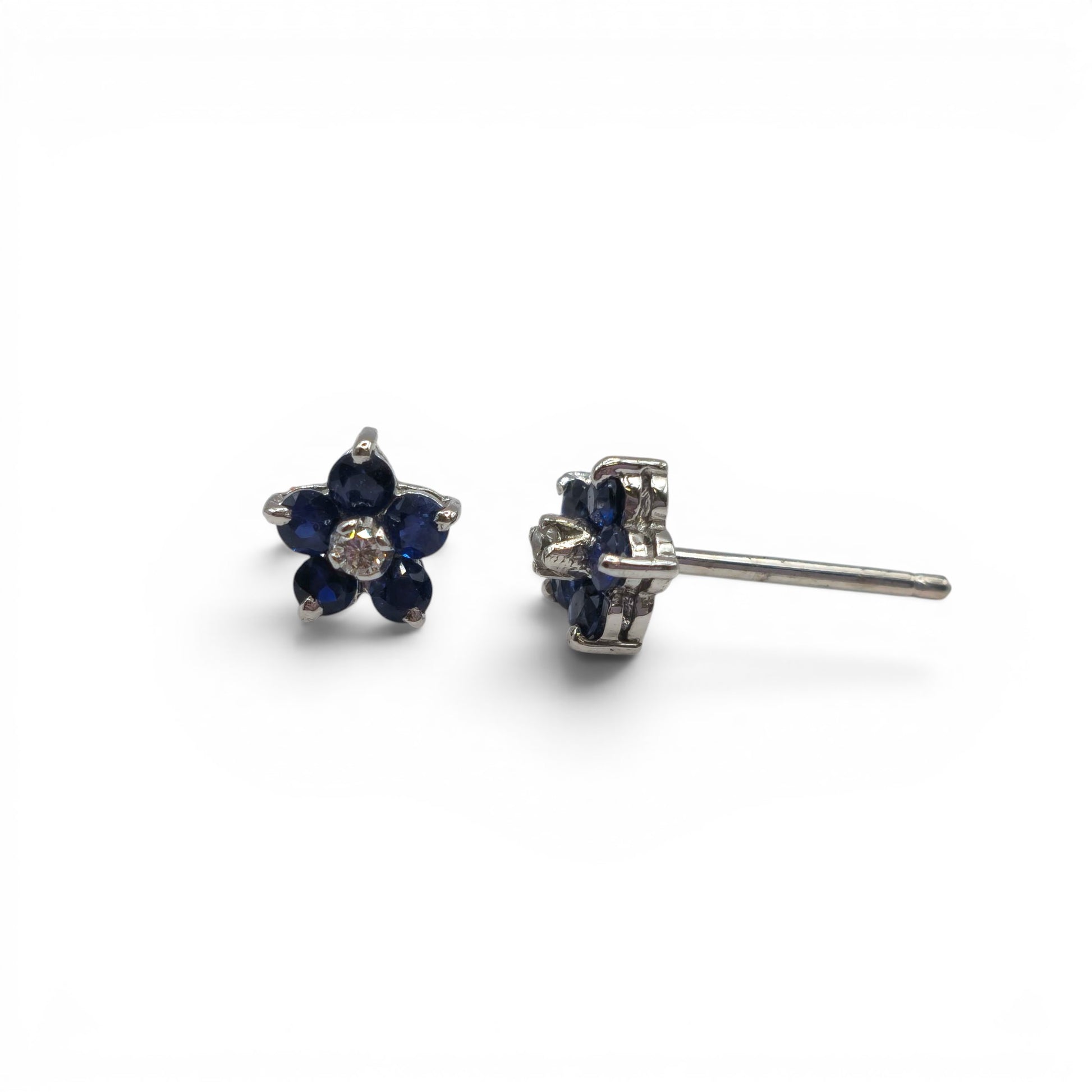18ct white gold daisy sapphire and diamond stud earrings by Reeves and Sons, featuring floral design with sparkling gemstones.