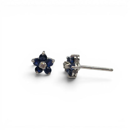 18ct white gold daisy sapphire and diamond stud earrings by Reeves and Sons, featuring floral design with sparkling gemstones.