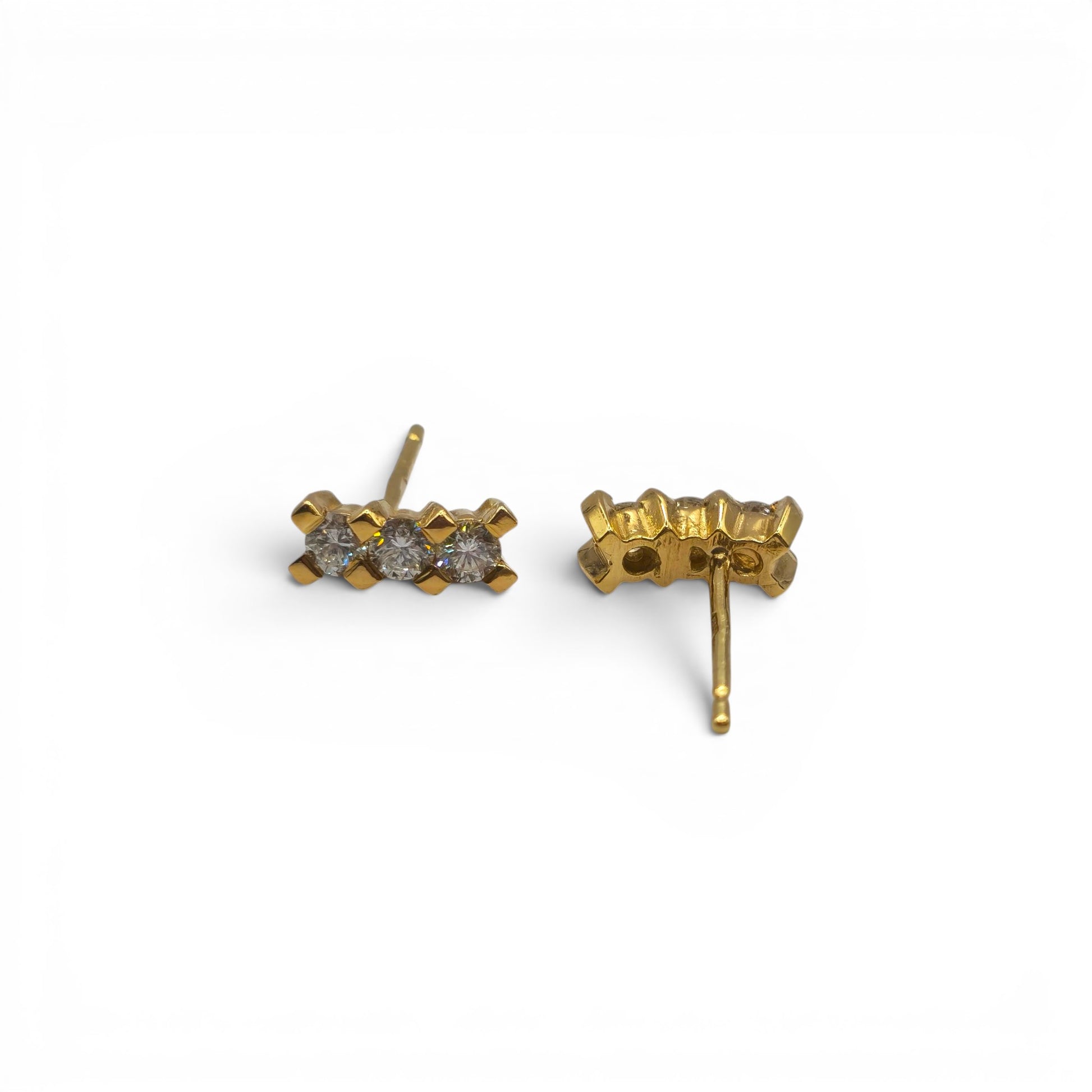 18ct yellow gold diamond stud earrings by Reeves and Sons, featuring sparkling diamonds set in classic gold settings.