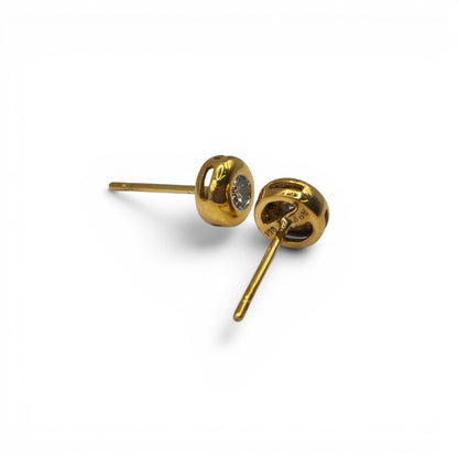 18ct yellow gold diamond stud earrings by Reeves and Sons, showcasing sparkling diamonds set in elegant gold settings.