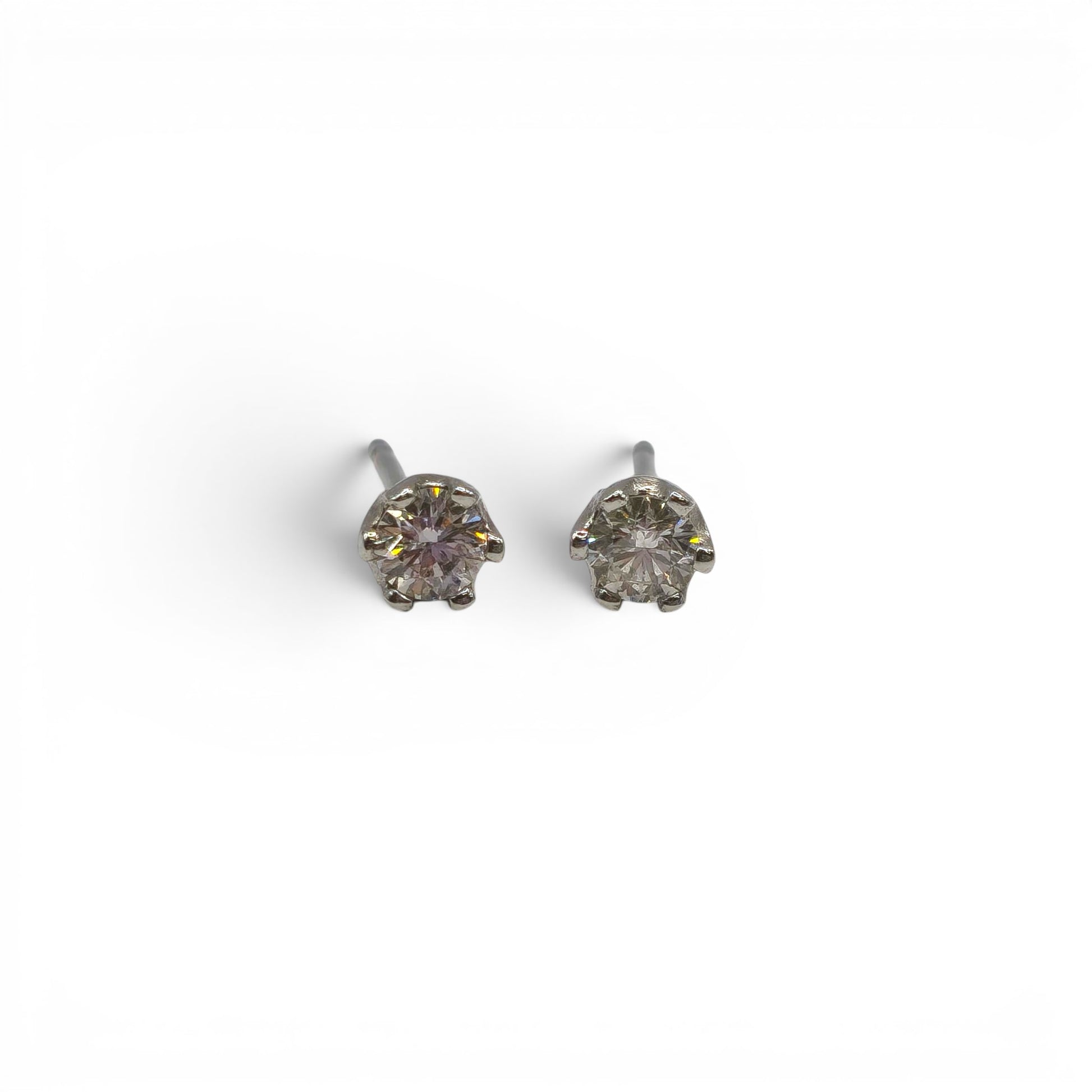 9ct white gold diamond stud earrings with sparkling diamonds, featuring a classic and elegant design by Reeves and Sons.