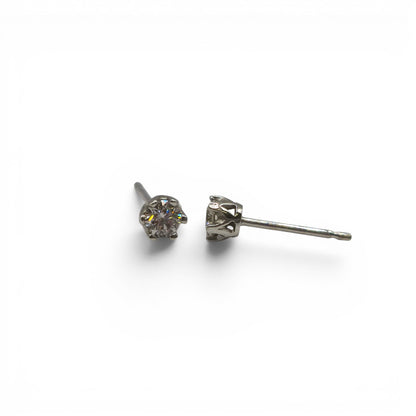 Pair of 9ct white gold diamond stud earrings with sparkling diamonds, designed by Reeves and Sons.
