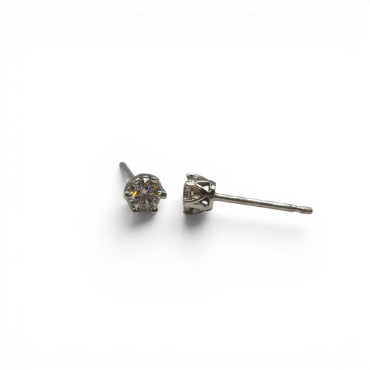 Pair of 9ct white gold diamond stud earrings with sparkling diamonds, designed by Reeves and Sons.