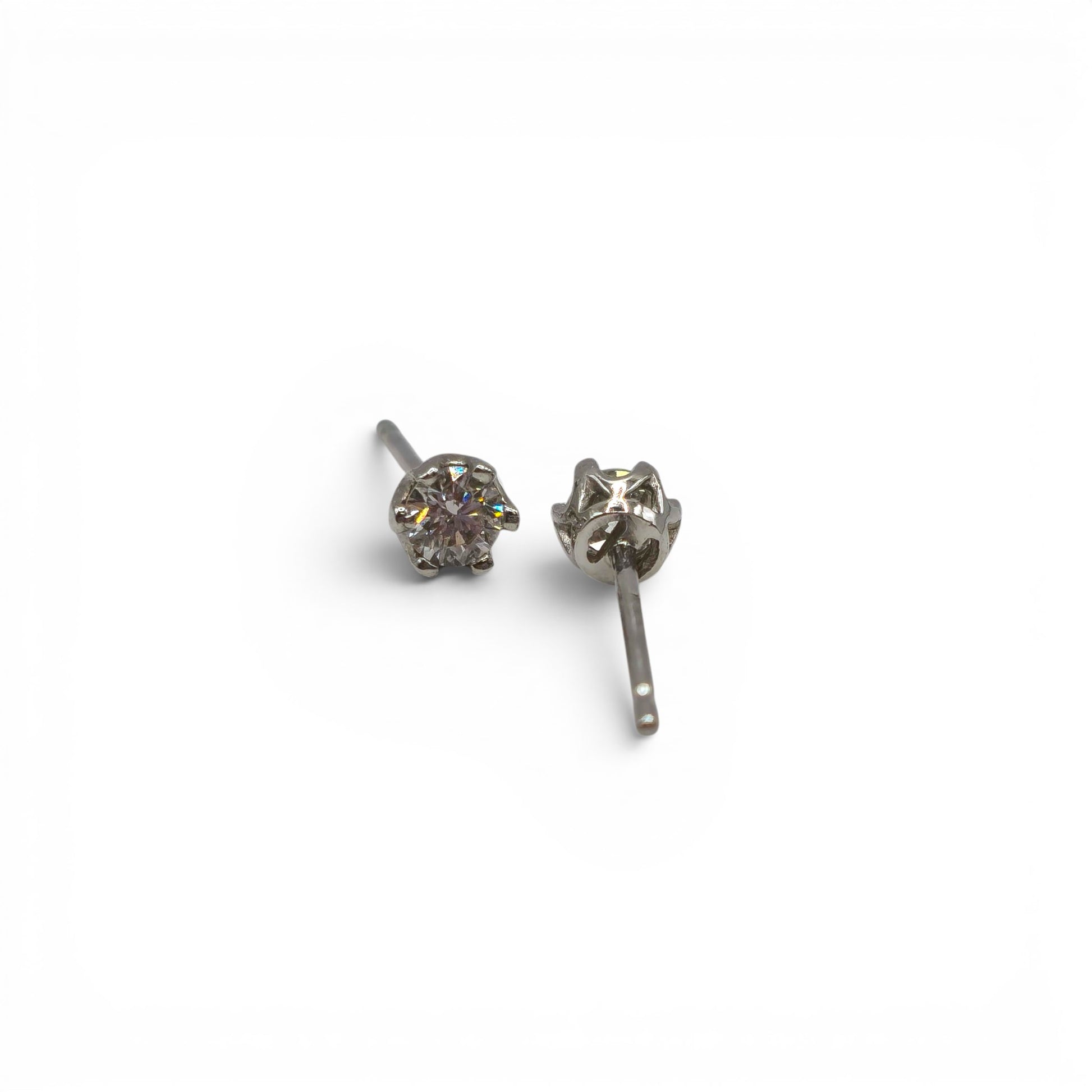 9ct white gold diamond stud earrings by Reeves and Sons, featuring sparkling diamonds set in a sleek, elegant design.