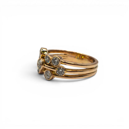 18ct rose gold diamond bubble ring by Reeves and Sons, featuring a delicate design with sparkling diamonds.