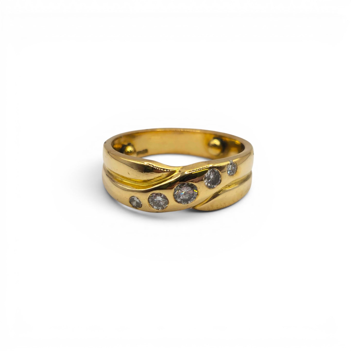 18ct yellow gold diamond crossover ring by Reeves and Sons, featuring sparkling diamonds and a sleek, elegant design.