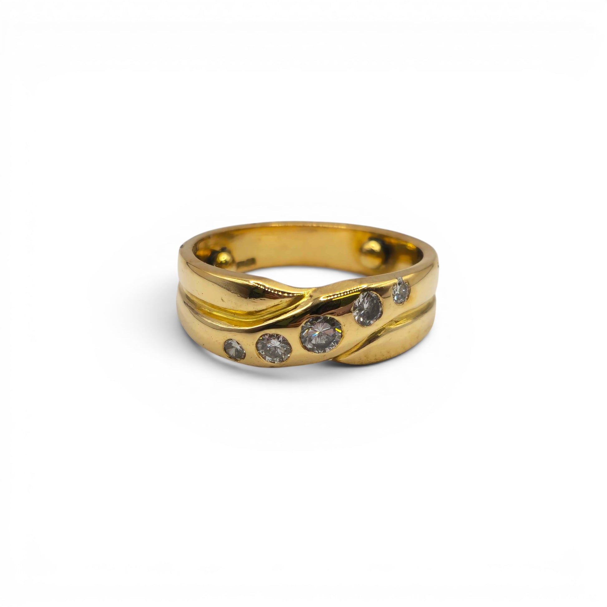 18ct yellow gold diamond crossover ring by Reeves and Sons, featuring sparkling diamonds and a sleek, elegant design.