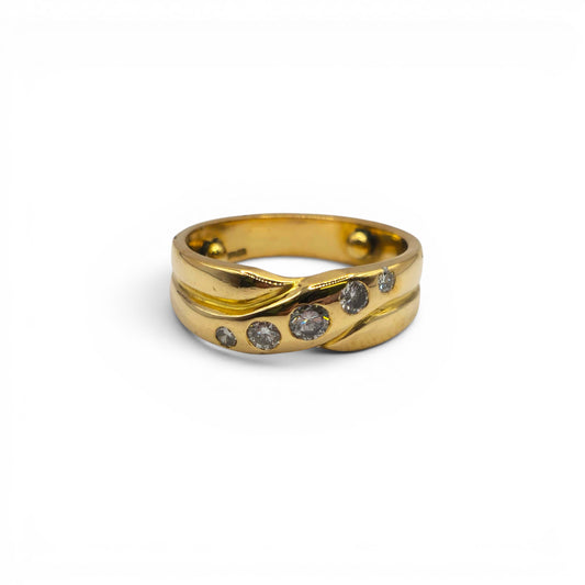 18ct yellow gold diamond crossover ring by Reeves and Sons, featuring sparkling diamonds and a sleek, elegant design.