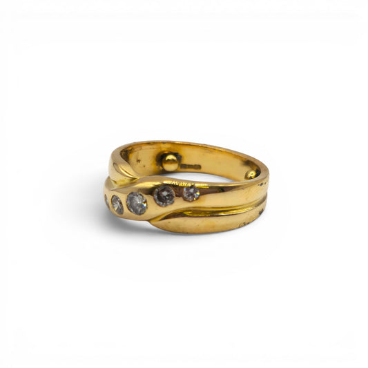 18ct yellow gold diamond crossover ring by Reeves and Sons, featuring sparkling diamonds and sleek design.