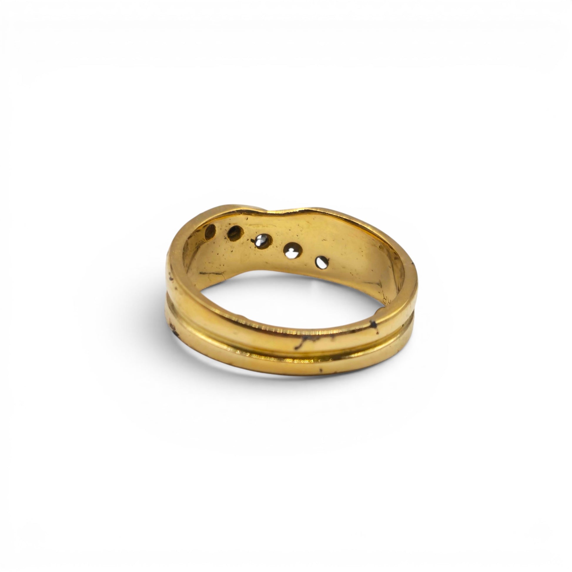 18ct yellow gold diamond crossover ring by Reeves and Sons, showcasing a stylish design with sparkling diamonds on a sleek band.