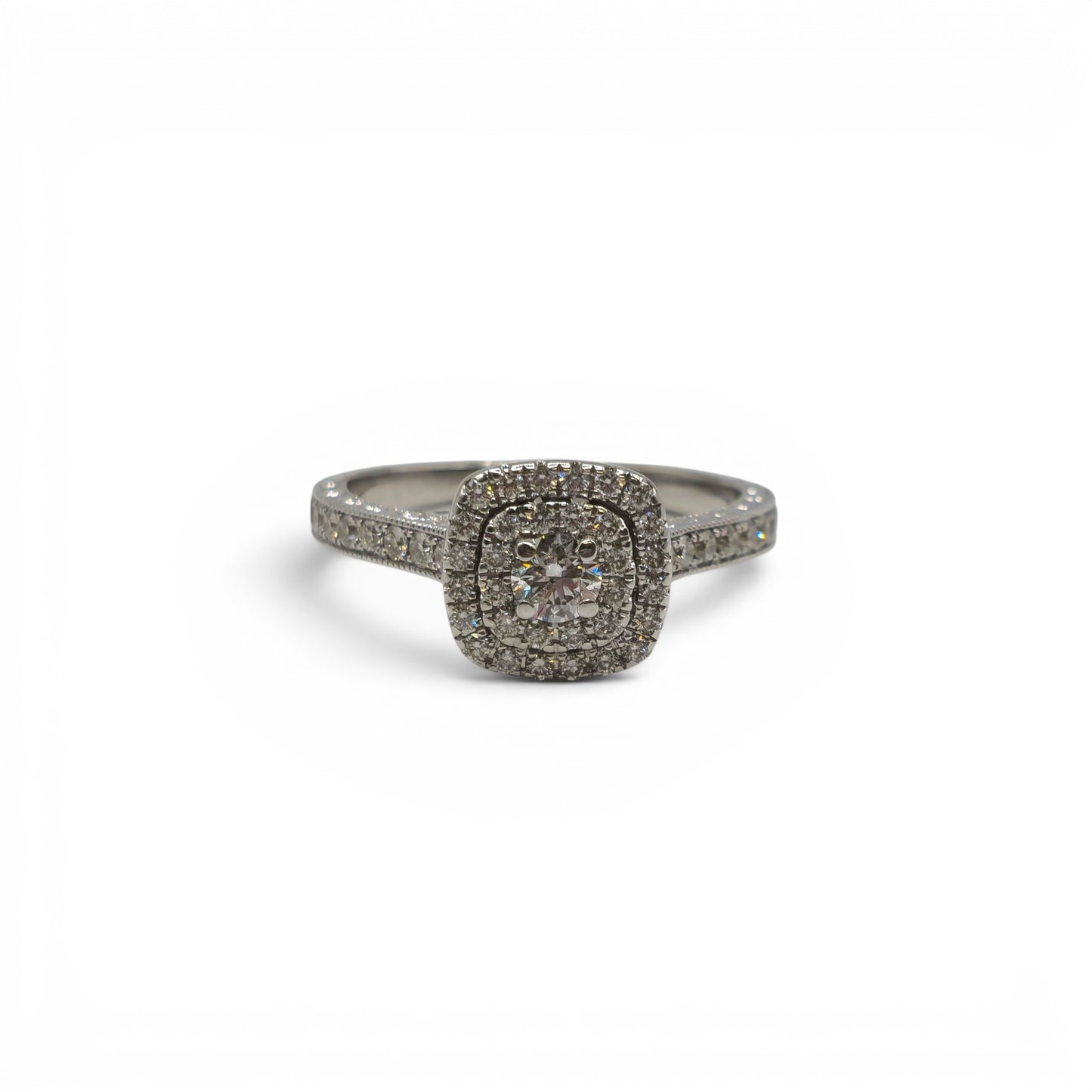 14ct white gold diamond cluster ring by Reeves and Sons with sparkling diamond details and intricate band design.
