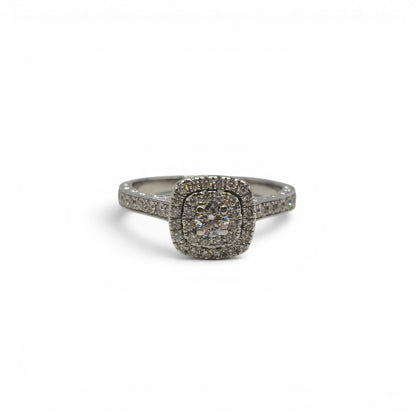 14ct white gold diamond cluster ring by Reeves and Sons with sparkling diamond details and intricate band design.