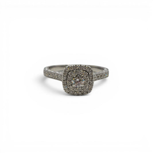 14ct white gold diamond cluster ring by Reeves and Sons with sparkling diamond details and intricate band design.