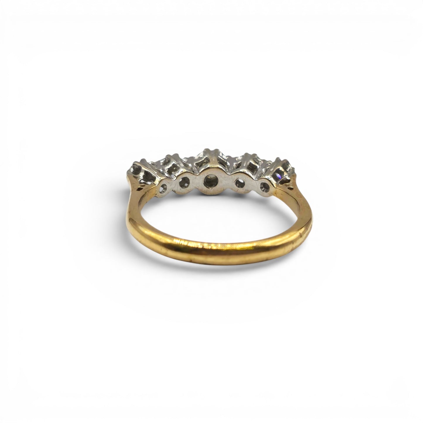 18ct yellow gold diamond ring by Reeves and Sons featuring a sparkling diamond centerpiece and elegant design.