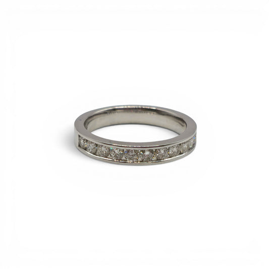 18ct white gold diamond half eternity ring with sparkling diamonds, featuring a sleek band design by Reeves and Sons.