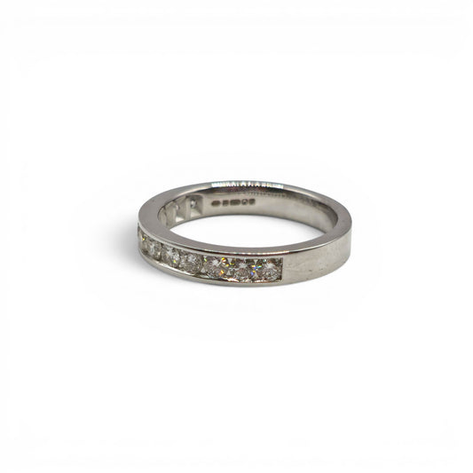 18ct white gold diamond half eternity ring with sparkling diamonds, crafted by Reeves and Sons.