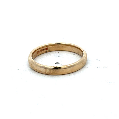 9ct yellow gold ring size N by Reeves and Sons, featuring a smooth polished band with a classic design.