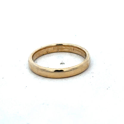 9ct yellow gold ring in size N by Reeves and Sons, showcasing a smooth polished band with subtle detailing.