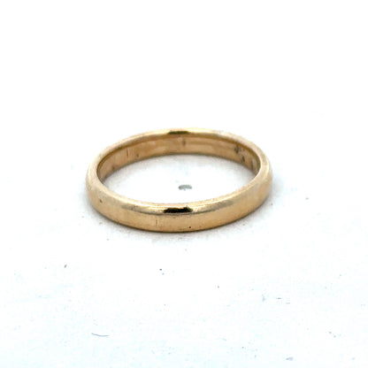 9ct yellow gold ring size N with a smooth band, crafted by Reeves and Sons, displayed on a neutral background.