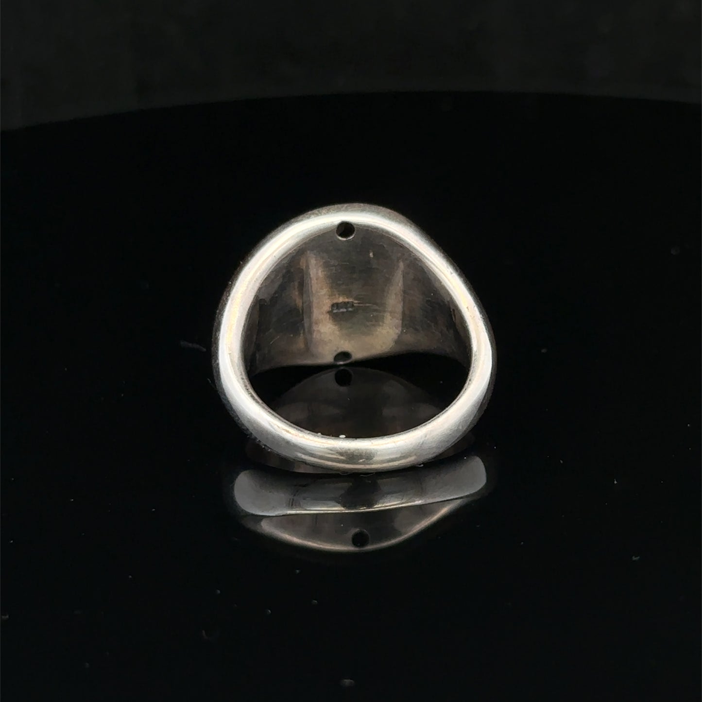 Silver ring size P by Reeves and Sons, featuring a smooth band design, shown on a neutral background.