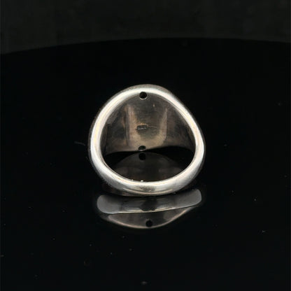 Silver ring size P by Reeves and Sons, featuring a smooth band design, shown on a neutral background.