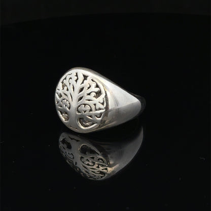Silver ring size P by Reeves and Sons, showing the detailed band design and shiny finish.
