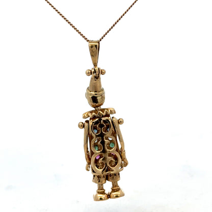 Yellow gold clown pendant from Reeves and Sons, 9ct gold, detailed design, weighing 8.7g, featuring playful clown motif.