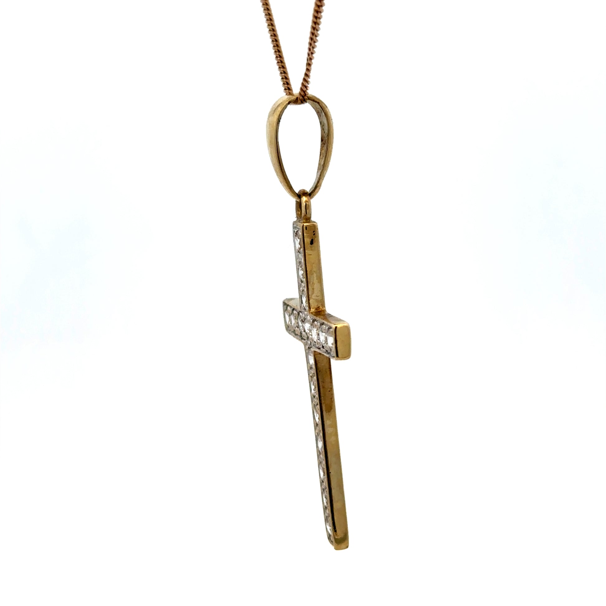 9ct yellow gold cross pendant weighing 4.6g with engraved details, featuring a classic religious jewelry design.