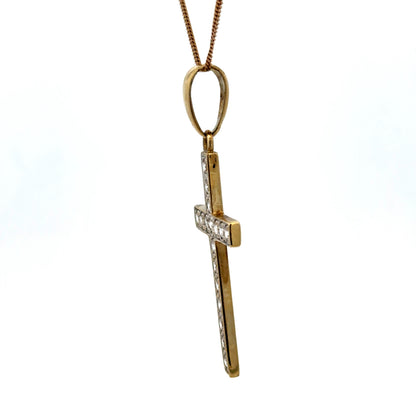 9ct yellow gold cross pendant weighing 4.6g with engraved details, featuring a classic religious jewelry design.