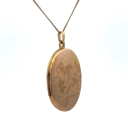 9ct yellow gold locket pendant from Reeves and Sons with a polished surface and intricate design, weighing 4.7g.