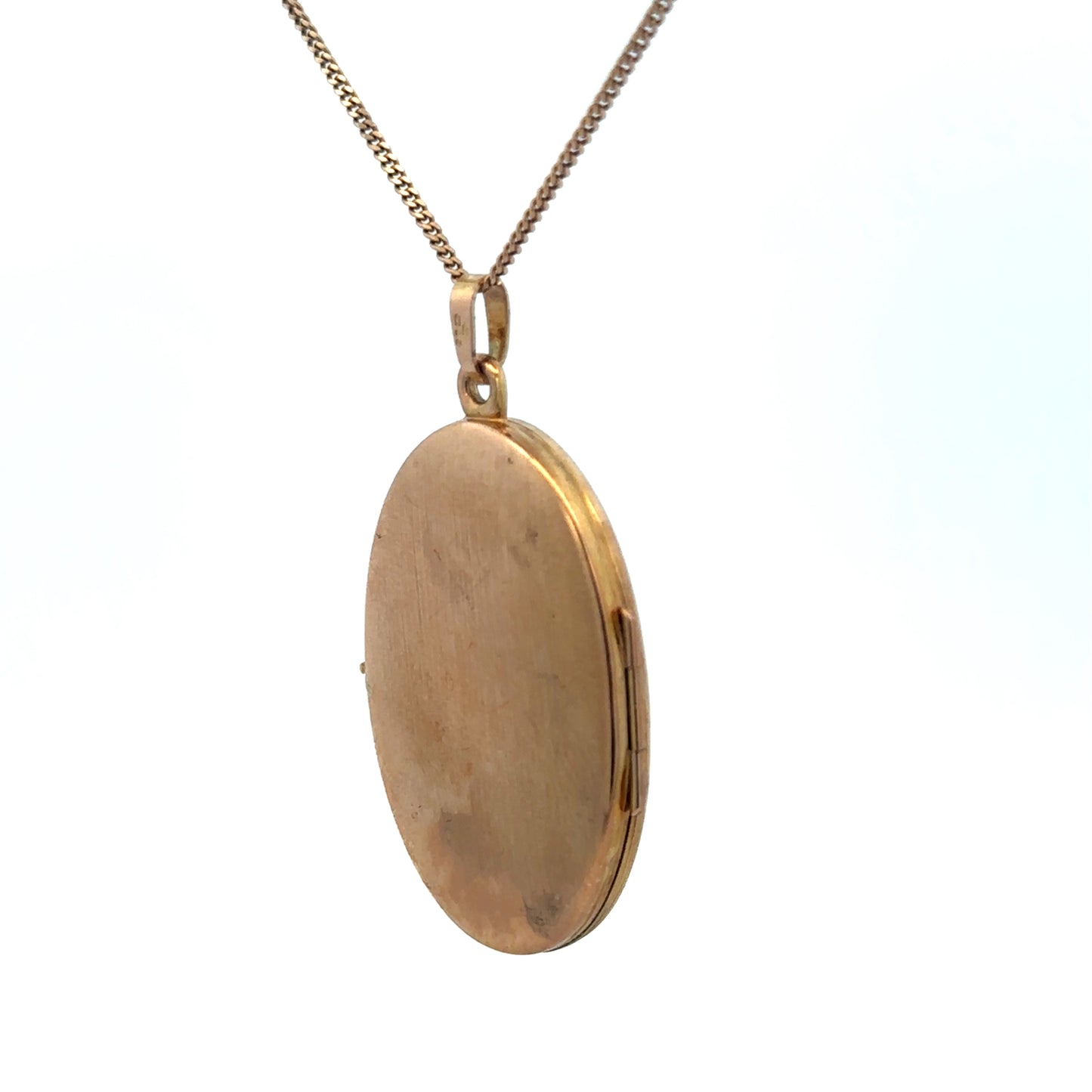 9ct yellow gold locket pendant with engraved details, weighing 4.7g, by Reeves and Sons, displayed against a neutral background.