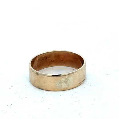 9ct yellow gold band ring in size P1/2 with smooth finish, crafted by Reeves and Sons, shown on a white background.